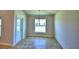 Dining area with tile floor, chandelier, and access to patio at 1269 Tagliamento Ln, Haines City, FL 33844