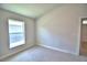 Bright bedroom with window and neutral walls at 1269 Tagliamento Ln, Haines City, FL 33844