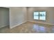 Spacious bedroom with tile flooring and large window at 1269 Tagliamento Ln, Haines City, FL 33844