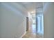 Bright hallway with tile flooring and access to rooms at 1269 Tagliamento Ln, Haines City, FL 33844