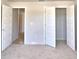 Well-lit bedroom with access to another room and closets at 1269 Tagliamento Ln, Haines City, FL 33844