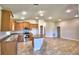 Open kitchen with island and stainless steel appliances at 1269 Tagliamento Ln, Haines City, FL 33844