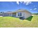 Home with a covered patio and spacious backyard at 1269 Tagliamento Ln, Haines City, FL 33844