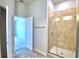 Bathroom with a large walk-in shower and tile flooring at 1269 Tagliamento Ln, Haines City, FL 33844