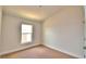 Bright bedroom with carpet and large window at 1265 Tagliamento Ln, Haines City, FL 33844