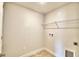 Laundry room with shelving and space for washer and dryer at 1265 Tagliamento Ln, Haines City, FL 33844