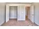 Bedroom with carpet, double door closet and access to a bathroom at 1265 Tagliamento Ln, Haines City, FL 33844