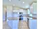 Modern kitchen with stainless steel appliances and island at 1253 Tagliamento Ln, Haines City, FL 33844