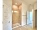 Modern bathroom featuring a shower and double doors at 1253 Tagliamento Ln, Haines City, FL 33844