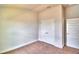 Well-lit bedroom with double door closet at 1253 Tagliamento Ln, Haines City, FL 33844