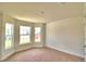 Charming bedroom with bay window and neutral decor at 1253 Tagliamento Ln, Haines City, FL 33844