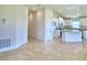 Open kitchen with island and stainless steel appliances at 1253 Tagliamento Ln, Haines City, FL 33844