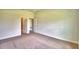 Main bedroom with carpet and access to bathroom and closet at 1253 Tagliamento Ln, Haines City, FL 33844