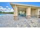 Poolside patio area with tables and chairs at 1253 Tagliamento Ln, Haines City, FL 33844