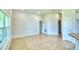 Spacious living room with large windows and tile flooring at 1253 Tagliamento Ln, Haines City, FL 33844