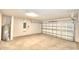 Empty garage with overhead door and water heater at 1253 Tagliamento Ln, Haines City, FL 33844