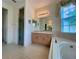Bathroom with soaking tub and walk-in shower at 3093 Dunmore Dr, Lake Wales, FL 33859