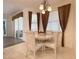 Bright dining area with a round table and four chairs at 3093 Dunmore Dr, Lake Wales, FL 33859