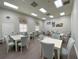 Community room with tables and chairs for gatherings at 3093 Dunmore Dr, Lake Wales, FL 33859
