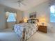 Bedroom with a queen-size bed, nightstands and window at 3093 Dunmore Dr, Lake Wales, FL 33859