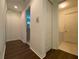Hallway with laundry room access and linen closet at 3093 Dunmore Dr, Lake Wales, FL 33859