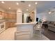 Kitchen with breakfast bar and view into living area at 3093 Dunmore Dr, Lake Wales, FL 33859