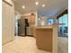 Spacious kitchen with stainless steel appliances and light wood cabinets at 3093 Dunmore Dr, Lake Wales, FL 33859