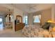 Bedroom with a queen bed, dresser, and access to other rooms at 3093 Dunmore Dr, Lake Wales, FL 33859