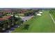 Aerial view of community with golf course and lake at 3093 Dunmore Dr, Lake Wales, FL 33859