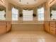 Spacious Primary bathroom with soaking tub, tile flooring, and double vanity at 3093 Dunmore Dr, Lake Wales, FL 33859