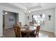 Charming dining room with round wooden table and chandelier at 1702 Parks Lake Rd, Lake Wales, FL 33898