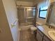Bathroom with shower/tub combo, toilet and vanity at 3130 Prairie Dunes W Cir, Lakeland, FL 33810