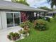 Backyard patio with lush landscaping and plants at 3130 Prairie Dunes W Cir, Lakeland, FL 33810