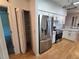 Modern kitchen with stainless steel refrigerator and ample pantry space at 3130 Prairie Dunes W Cir, Lakeland, FL 33810