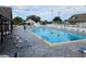 Inviting community swimming pool with plenty of lounge chairs at 3130 Prairie Dunes W Cir, Lakeland, FL 33810