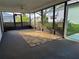 Enclosed Florida room with carpet flooring and ceiling fan at 3130 Prairie Dunes W Cir, Lakeland, FL 33810