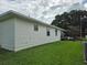 Side view of the house showcasing its clean, white siding at 3130 Prairie Dunes W Cir, Lakeland, FL 33810