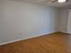 Spacious bedroom with wood floors and sliding door to patio at 3130 Prairie Dunes W Cir, Lakeland, FL 33810