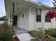 Inviting front entrance with a well-maintained flower bed at 3130 Prairie Dunes W Cir, Lakeland, FL 33810