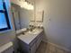 Bathroom with vanity, sink, and mirror at 3130 Prairie Dunes W Cir, Lakeland, FL 33810