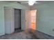 Bedroom with double door closet and view into kitchen at 3130 Prairie Dunes W Cir, Lakeland, FL 33810