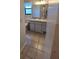 Clean bathroom with tiled floor and vanity with sink at 3130 Prairie Dunes W Cir, Lakeland, FL 33810
