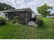 Spacious screened patio with lush landscaping, perfect for outdoor enjoyment at 3130 Prairie Dunes W Cir, Lakeland, FL 33810