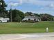 Partial view of a golf course with lush green grass at 3130 Prairie Dunes W Cir, Lakeland, FL 33810