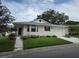 House exterior with landscaping and driveway at 3130 Prairie Dunes W Cir, Lakeland, FL 33810