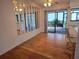 Dining area with wood floors and access to the patio at 3130 Prairie Dunes W Cir, Lakeland, FL 33810