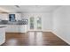 Kitchen dining area features wood-look floors and French doors leading to the backyard at 1510 Richmond Rd, Lakeland, FL 33801