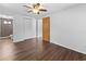 Main bedroom features wood-look floors, ceiling fan and ensuite bathroom at 1510 Richmond Rd, Lakeland, FL 33801