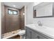 Updated bathroom with gray vanity, hexagon tile shower, and modern fixtures at 1510 Richmond Rd, Lakeland, FL 33801