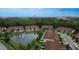 Aerial view of townhouses near a pond at 8153 Roseville Rd, Davenport, FL 33896